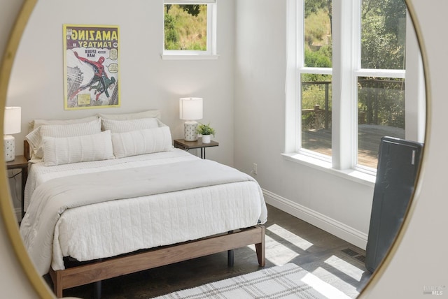 bedroom with wood-type flooring