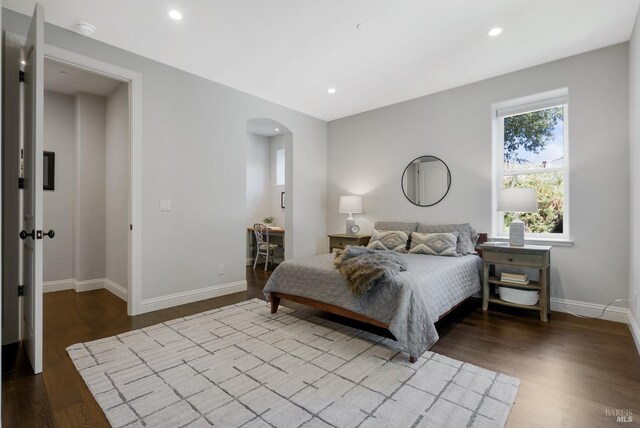 bedroom with hardwood / wood-style flooring