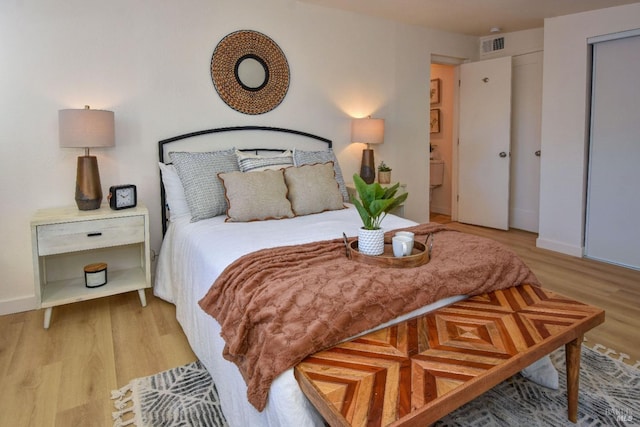 bedroom with light hardwood / wood-style flooring