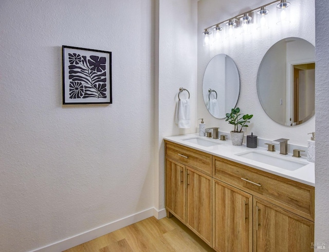 bathroom featuring vanity and hardwood / wood-style floors