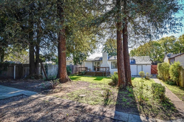 view of yard with a wooden deck