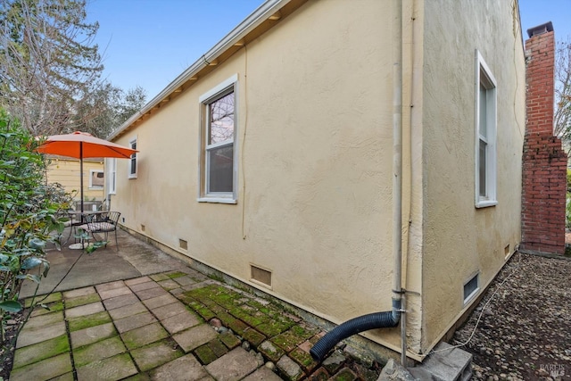 view of home's exterior with a patio area