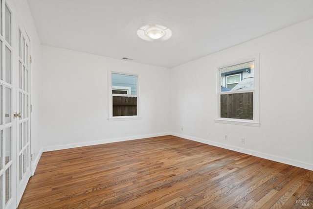 empty room featuring wood-type flooring