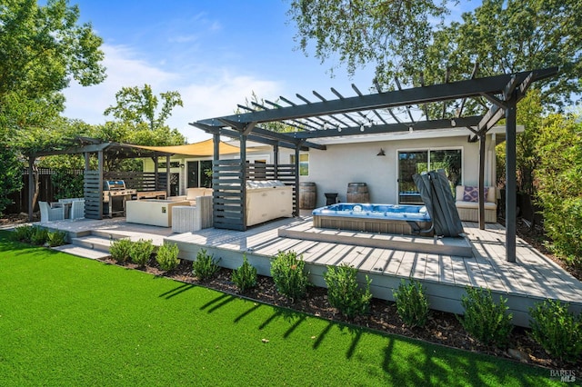 back of house featuring a deck, fence, a lawn, stucco siding, and a pergola