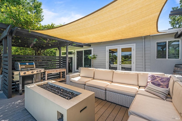 wooden terrace with french doors, an outdoor living space with a fire pit, and a pergola