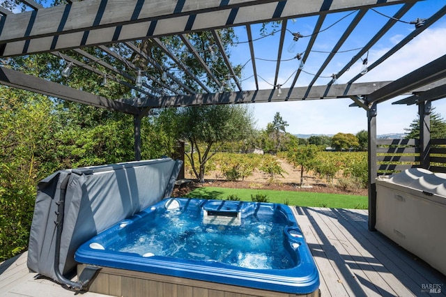 view of pool featuring a pergola, a deck, and a covered hot tub