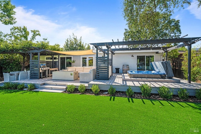 rear view of house featuring a lawn, an outdoor hangout area, a pergola, and a wooden deck