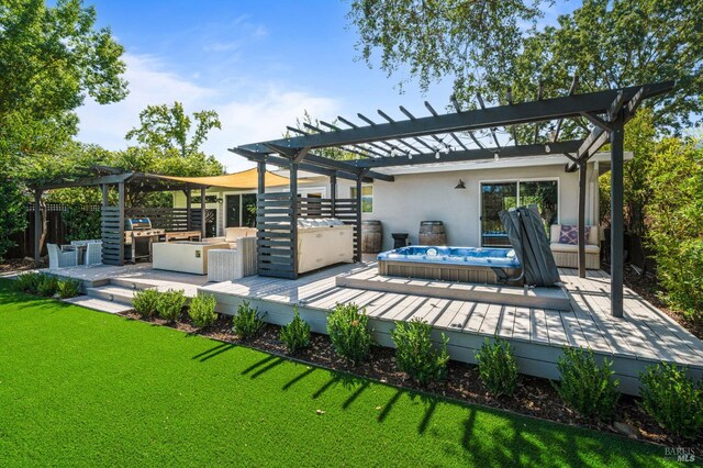 view of patio / terrace with an outdoor hot tub, a pergola, and a wooden deck