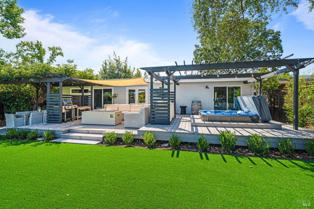 rear view of property with a yard, a wooden deck, a pergola, and an outdoor hangout area