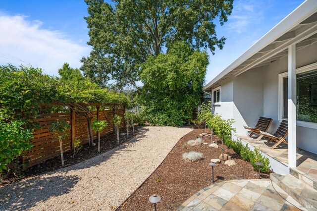 view of yard featuring a fenced backyard and a patio area