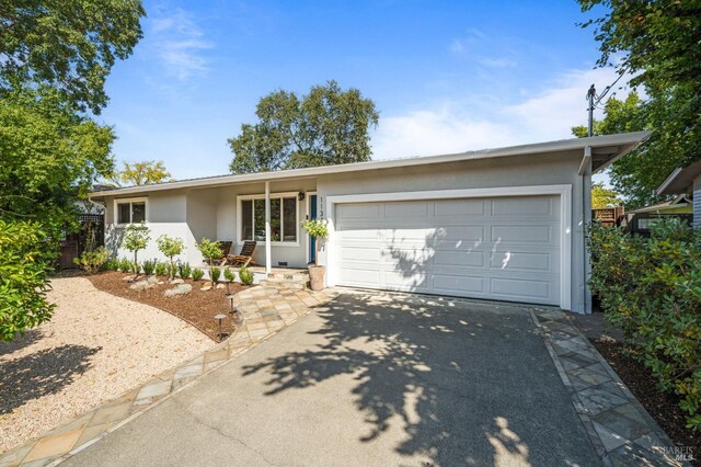 ranch-style house featuring a garage