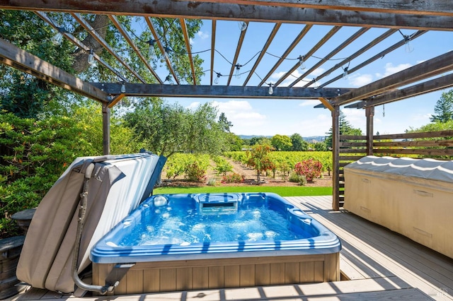 view of pool featuring a pergola, a covered hot tub, and a wooden deck