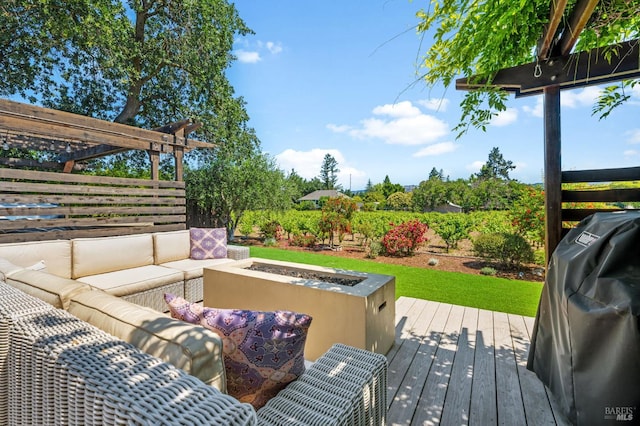 deck with grilling area, an outdoor hangout area, and a pergola