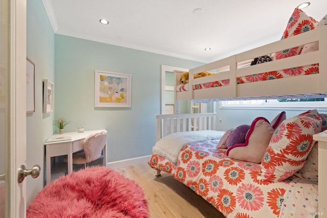 bedroom featuring recessed lighting, baseboards, crown molding, and wood finished floors