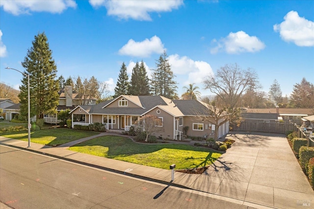 view of front of property with a front lawn and a garage