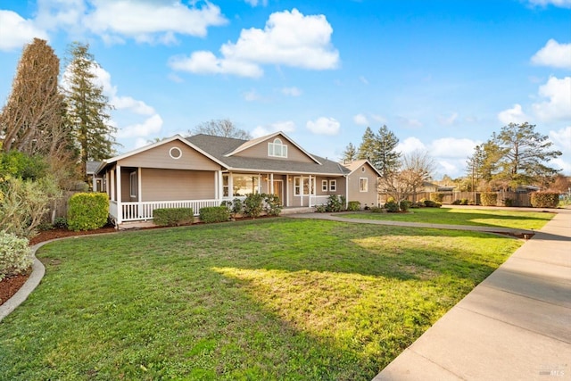 view of front of home featuring a front yard and covered porch