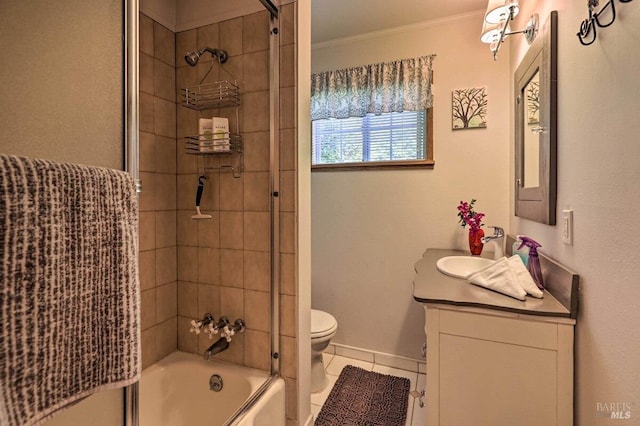 full bathroom with shower / bath combination with glass door, vanity, ornamental molding, tile patterned floors, and toilet