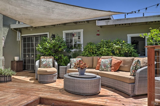 wooden deck featuring outdoor lounge area