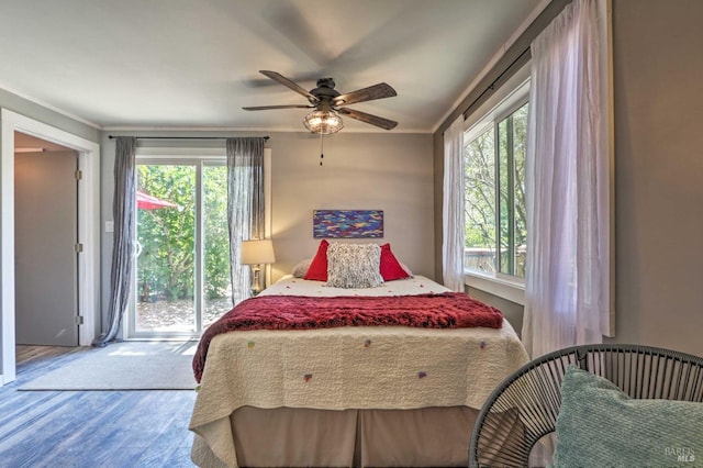 bedroom featuring crown molding, hardwood / wood-style flooring, access to outside, and ceiling fan