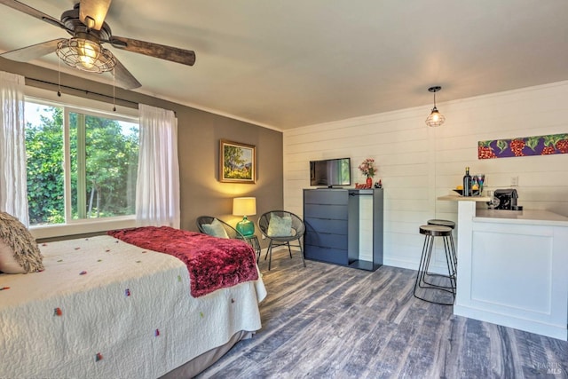 bedroom with hardwood / wood-style floors and ceiling fan