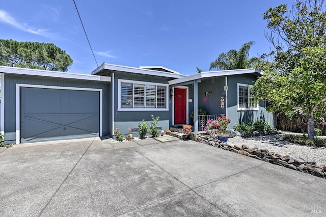 ranch-style home featuring a garage