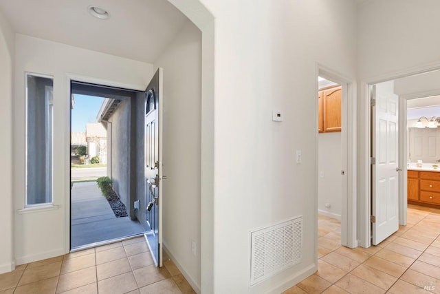 entrance foyer featuring light tile patterned floors