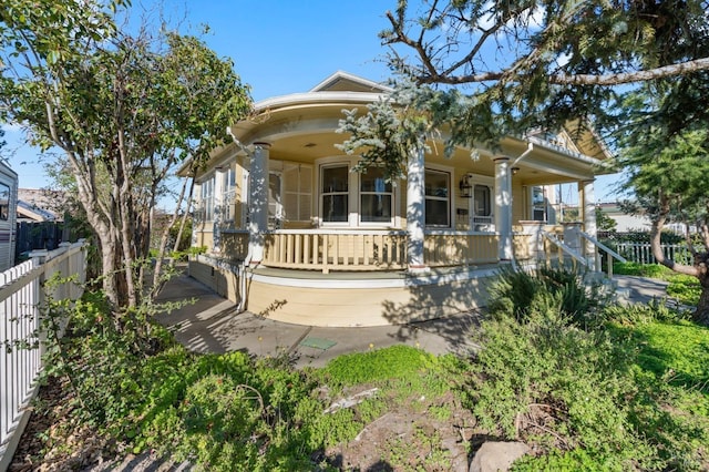 view of front of property featuring covered porch