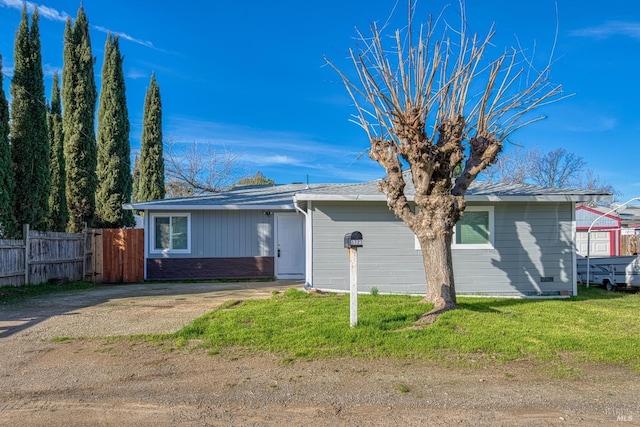 ranch-style house with a front yard