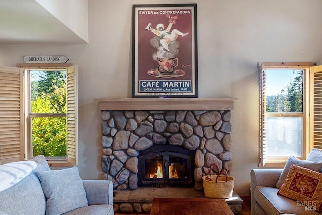 living room featuring a healthy amount of sunlight and a fireplace