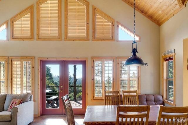 doorway to outside with high vaulted ceiling, wooden ceiling, and french doors