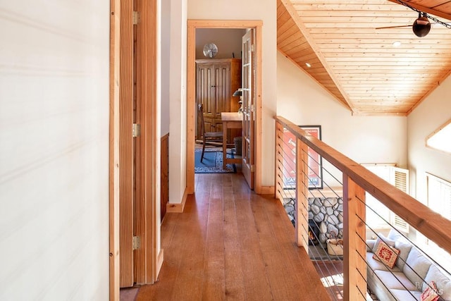 corridor featuring dark hardwood / wood-style floors and wood ceiling