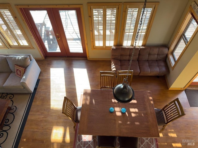 40695 Roseman Creek Rd, Gualala, CA 95445 - dining room featuring french doors, wood finished floors, and baseboards