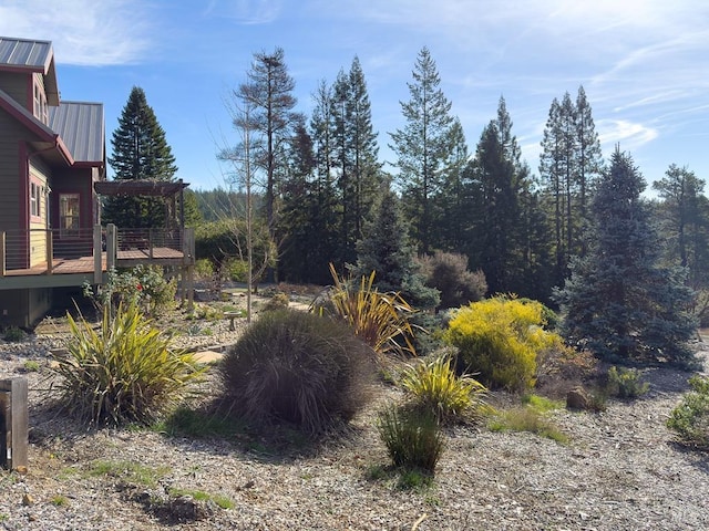 view of yard featuring a pergola and a wooden deck