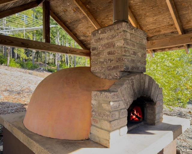 exterior details with an outdoor stone fireplace