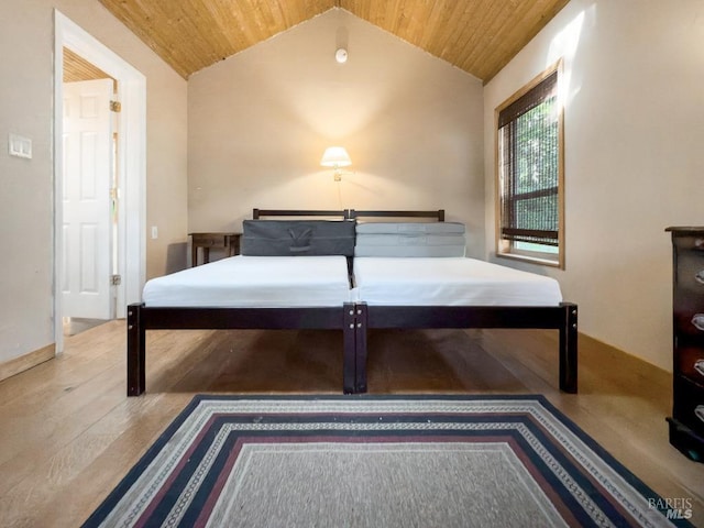 bedroom with wood-type flooring, wood ceiling, and vaulted ceiling