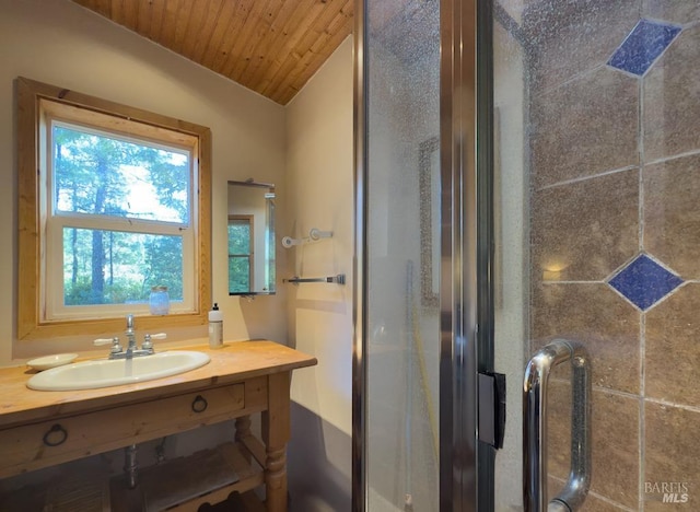 bathroom featuring lofted ceiling, a shower with door, sink, and wooden ceiling