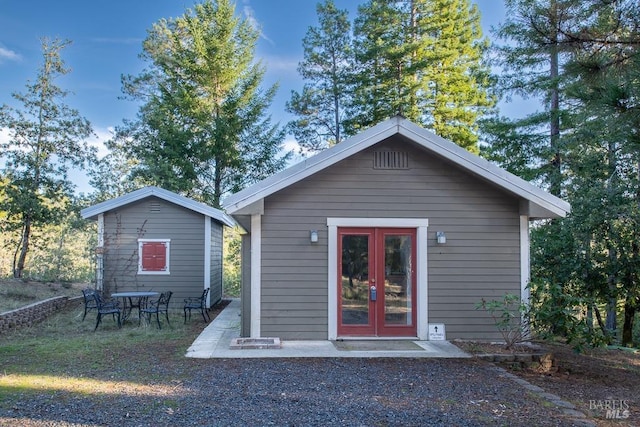 40695 Roseman Creek Rd, Gualala, CA 95445 - rear view of property featuring an outbuilding and french doors