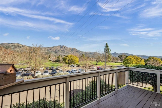 wooden deck featuring a mountain view