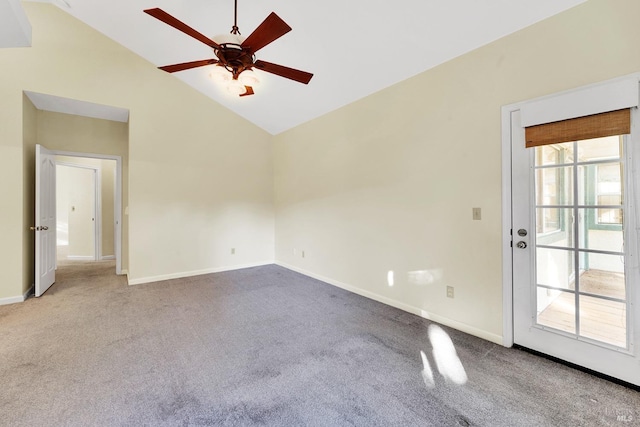 carpeted empty room featuring high vaulted ceiling and ceiling fan