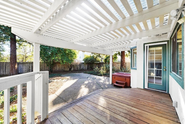 deck featuring a pergola and a hot tub