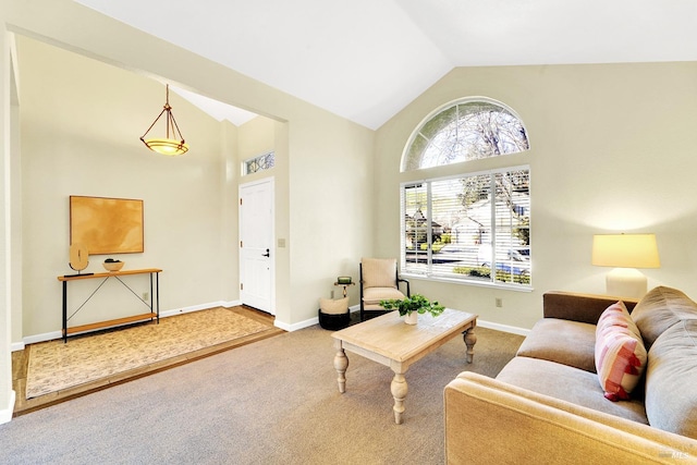 carpeted living room featuring lofted ceiling