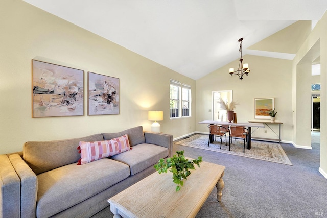 living room featuring carpet, vaulted ceiling, and a notable chandelier