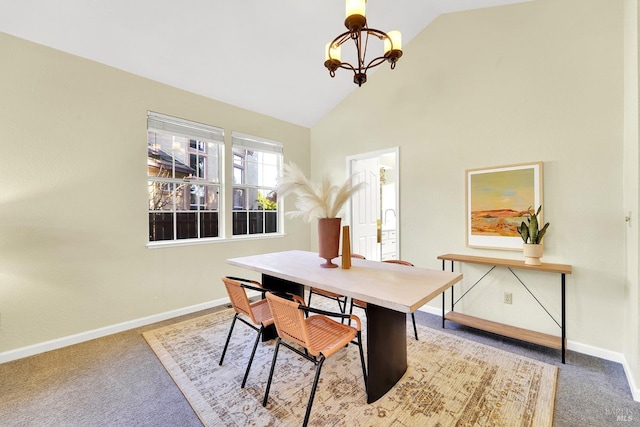 dining space with a chandelier, carpet flooring, and high vaulted ceiling