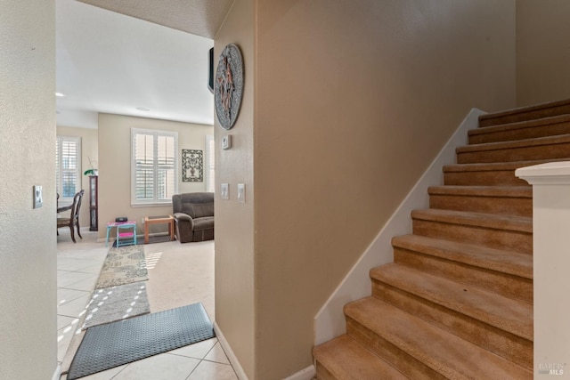 staircase with tile patterned flooring