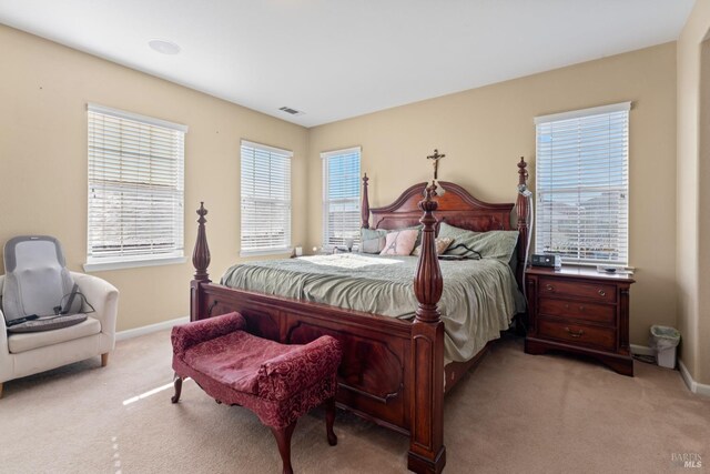 bedroom with light carpet