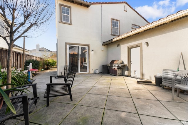 back of property with a patio