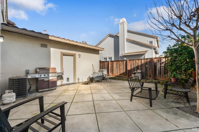 view of patio / terrace featuring outdoor lounge area and a storage shed