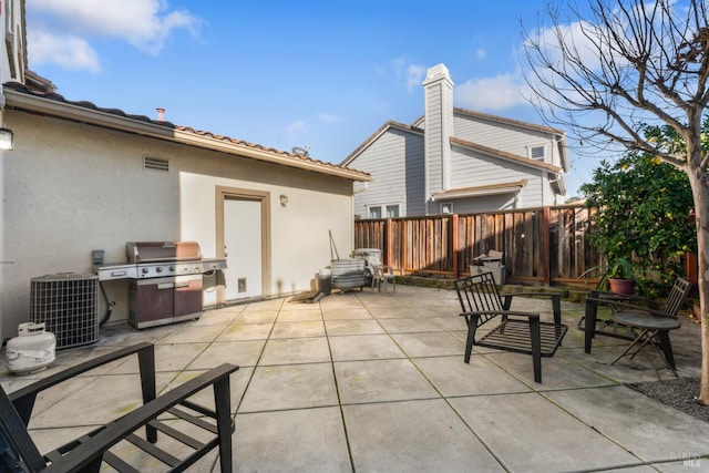 view of patio featuring central AC and a grill