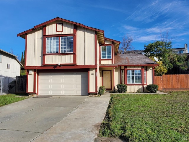 view of front of house featuring a front lawn and a garage