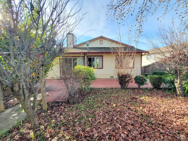 back of property featuring a patio area